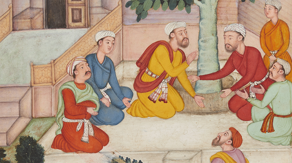 Two men in a courtyard converse beside a tree as five other men watch.
